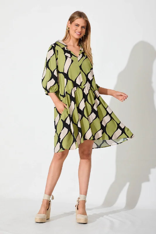 Forrest Smock Dress In Green With Black And White Print Hot new arrivals in floral dresses